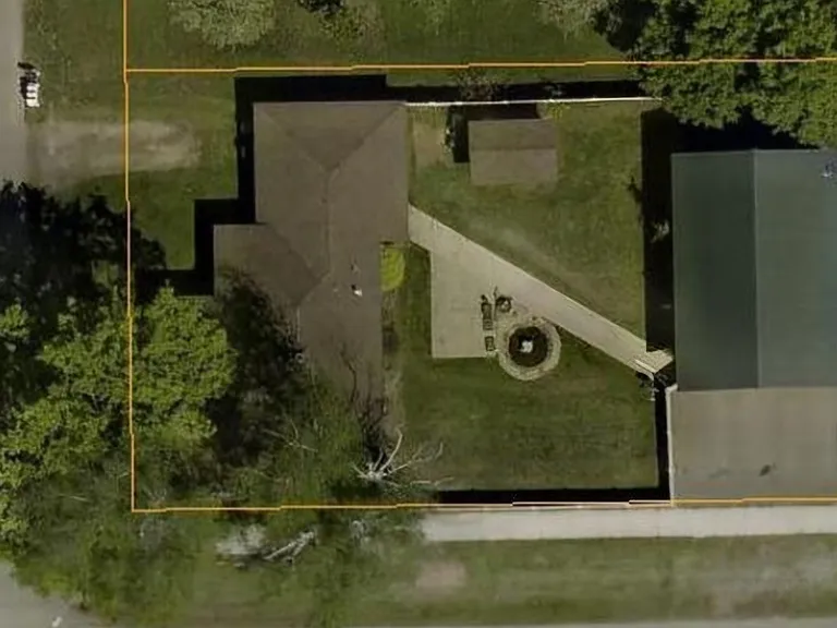 Aerial View of property. Rent includes home, back yard, and shop. Owners retain yard on the other side of the shop.
