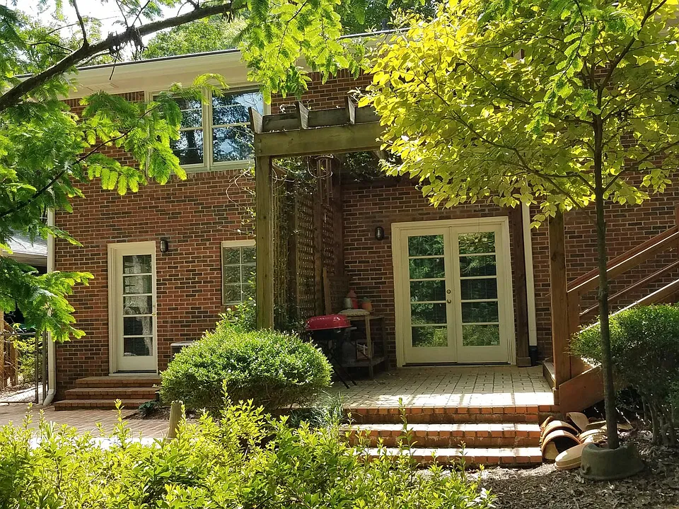 Private entry & terrace at left, additional terrace & garden access on right
