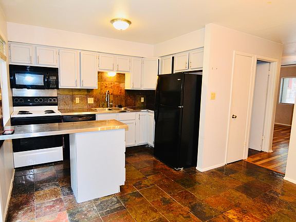 kitchen with stainless steel counters, open space