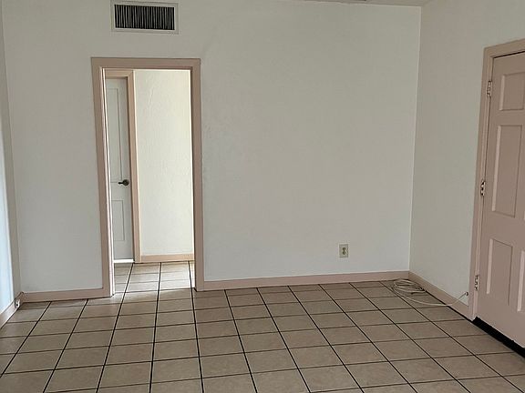 Living room to hall (front door on the right)