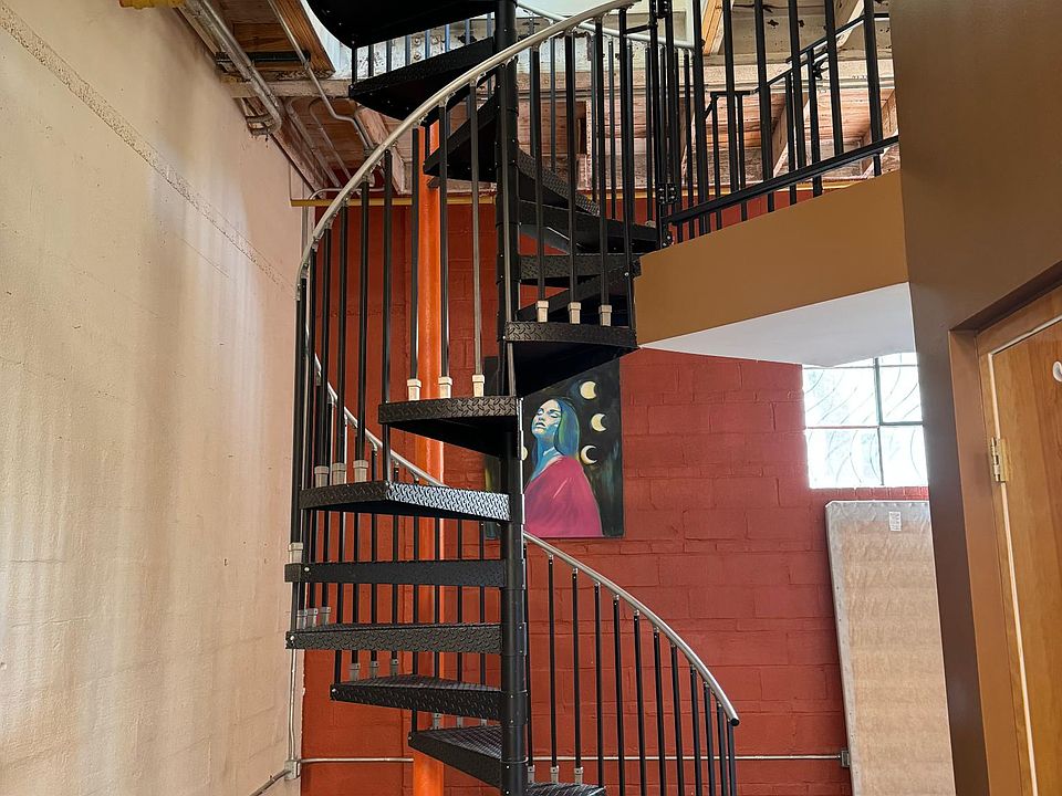 Spiral staircase to lofted space/room and rooftop.