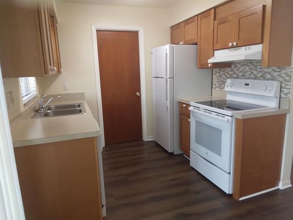Standing in dinning area looking into kitchen