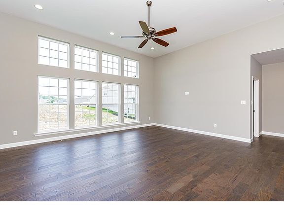 Great Room with Hardwood Floors, 12 Foot Ceilings and a Window Wall