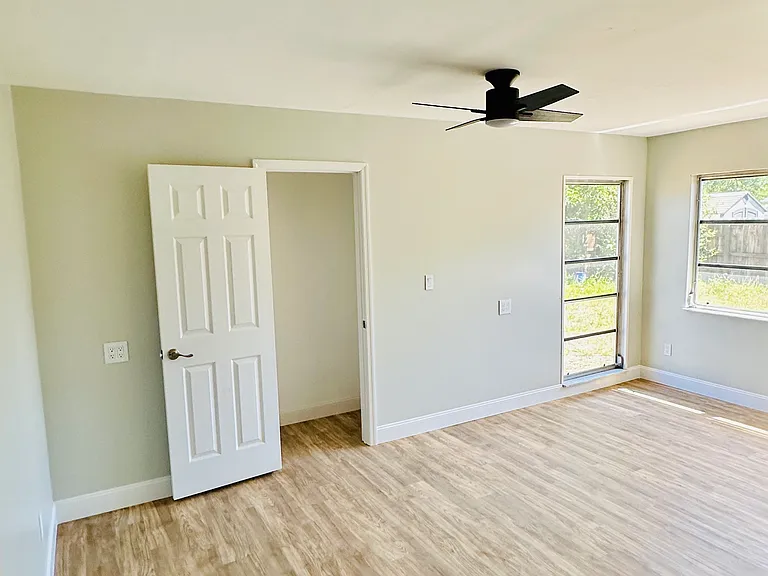3rd Bedroom with curtains and nice windows