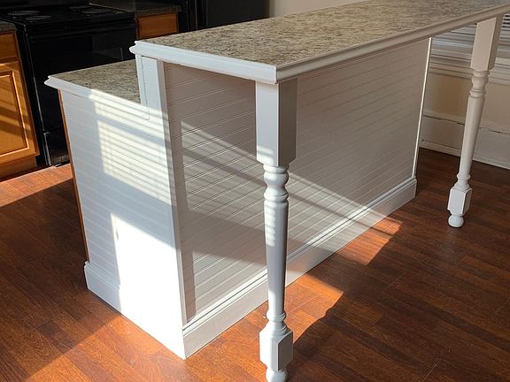 multi level so you can have bar stools on one side, and use the other for prep space.