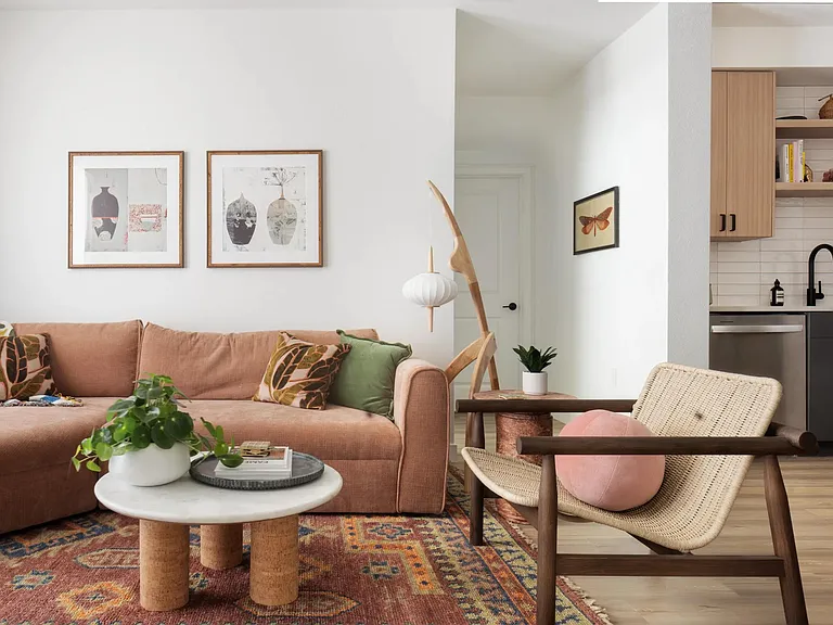 Open-concept living with warm wood finishes, stainless steel appliances, and a seamless flow from kitchen to lounge_designed for everyday ease.