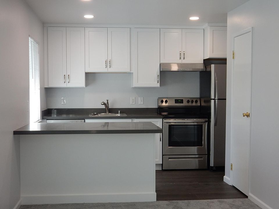 Recently remodeled kitchen with dishwasher, stainless steel appliances and peninsula