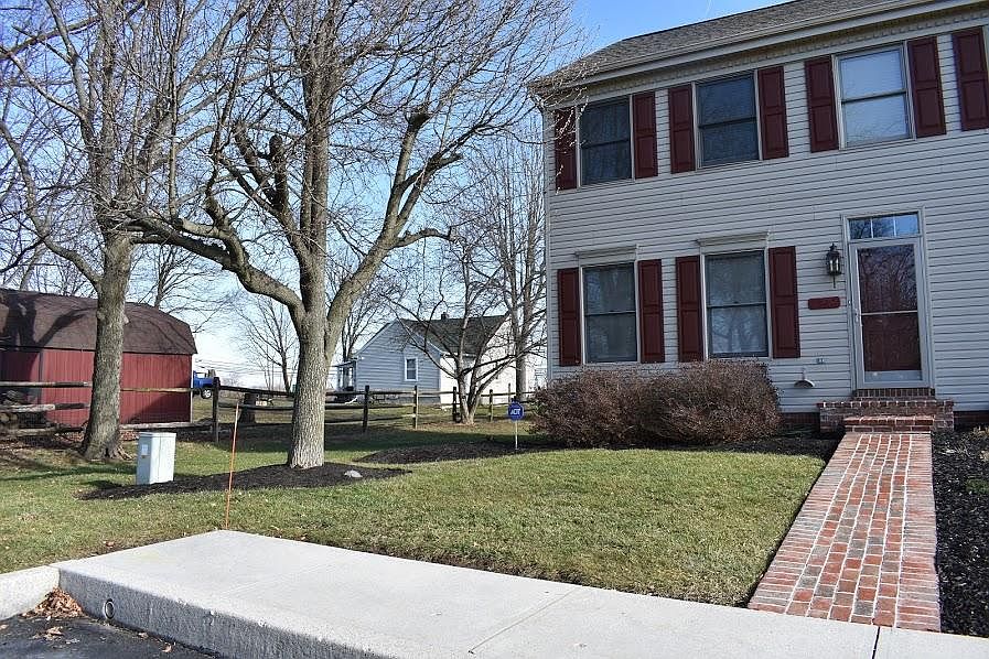 Nicely landscaped front/side yards