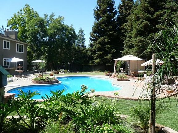 Backyard with sparkling pool and gazebo