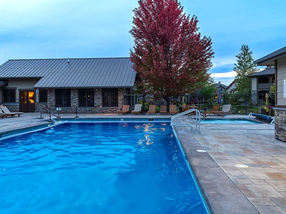 Community clubhouse with a heated pool and hot tub open year round