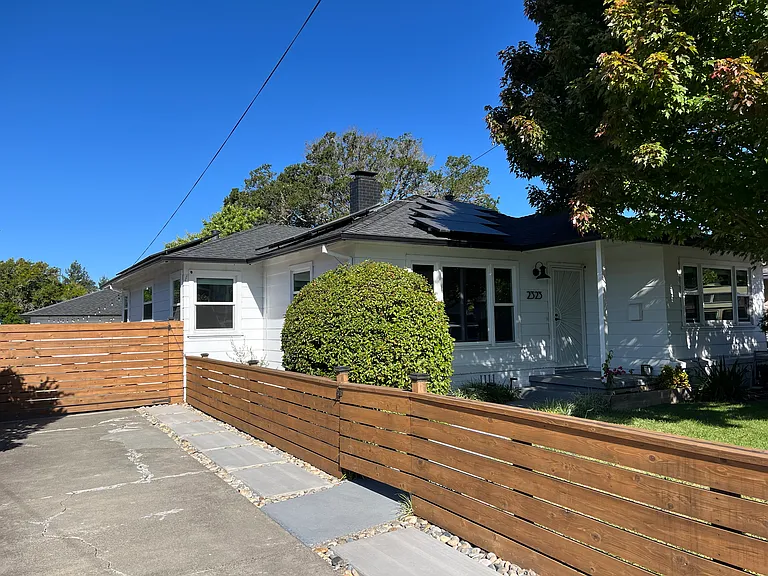Fenced front yard & driveway