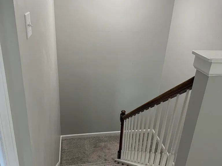 Stairs to second floor. New carpeting throughout.