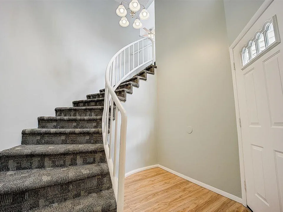 Front entry and stairs (left) and front door (right) from garage entrance.