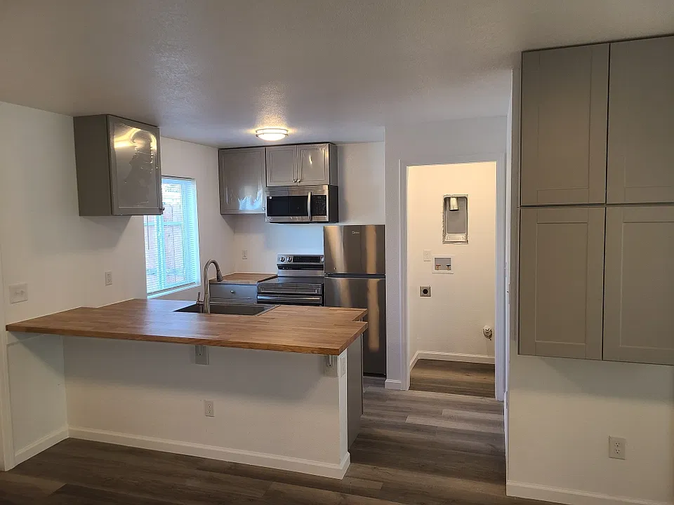 Kitchen with niche for washer and dry hookups (Washer/Dryer units not provided).