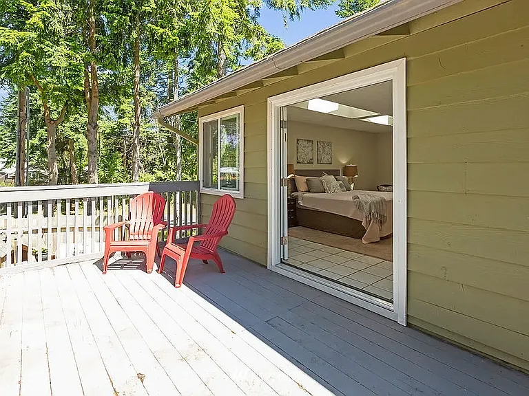 Primary Suite Private Deck. Deck to be replaced. (Photo from Previous Listing)