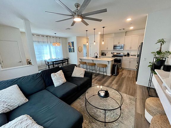 Downstairs, open concept. Couch, coffee table and stools included