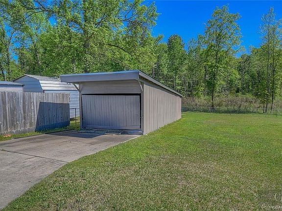 Large Storage Building off extended driveway! Could be used as boat storage too!