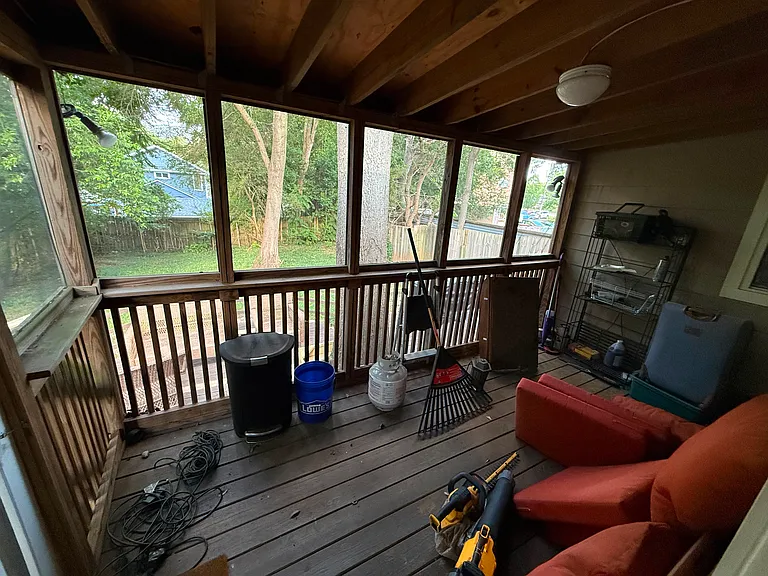 screened in deck against house...above outdoor two tiered deck. great for parties or grilling