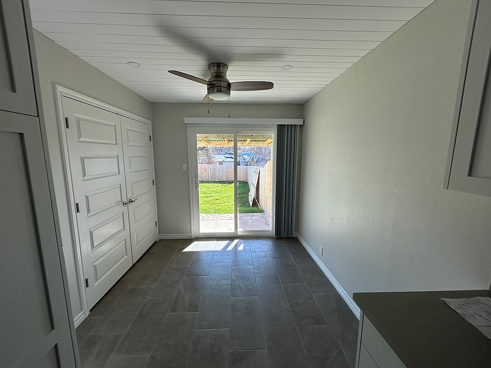 DINING AREA AND VIEW TO PRIVATE BACKYARD