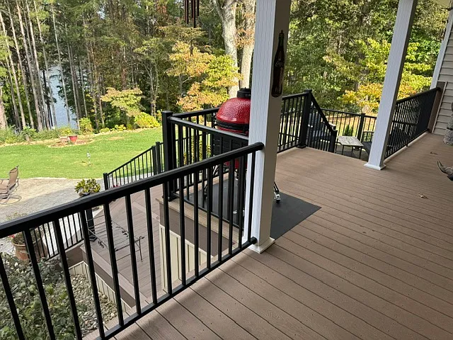 Private back yard with 3 level deck, patio and lake view