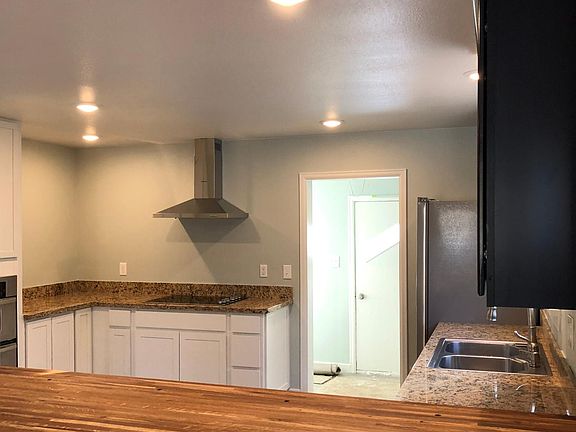Kitchen: Hard wood bar top and granite