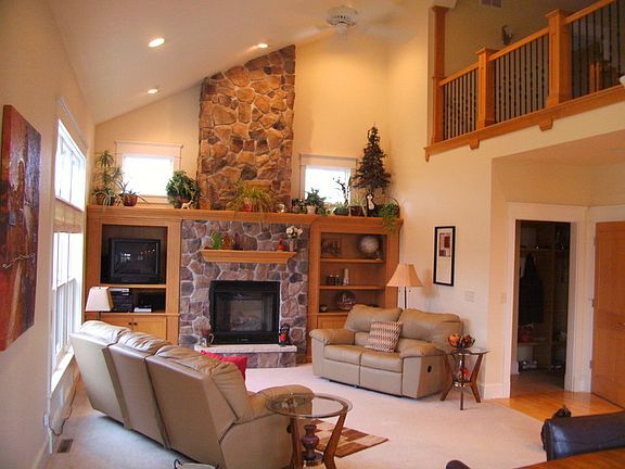 Features vaulted ceilings with fieldstone gas fireplace and second floor loft
