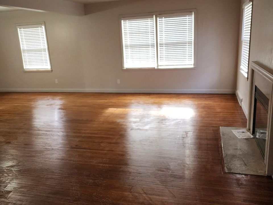 Living room with electric insert in fireplace.