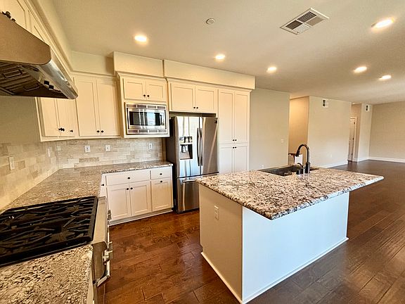Bright east-facing kitchen with top of the line appliances and granite countertops