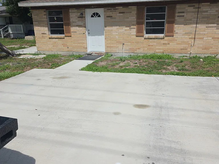 Front entrance with large driveway