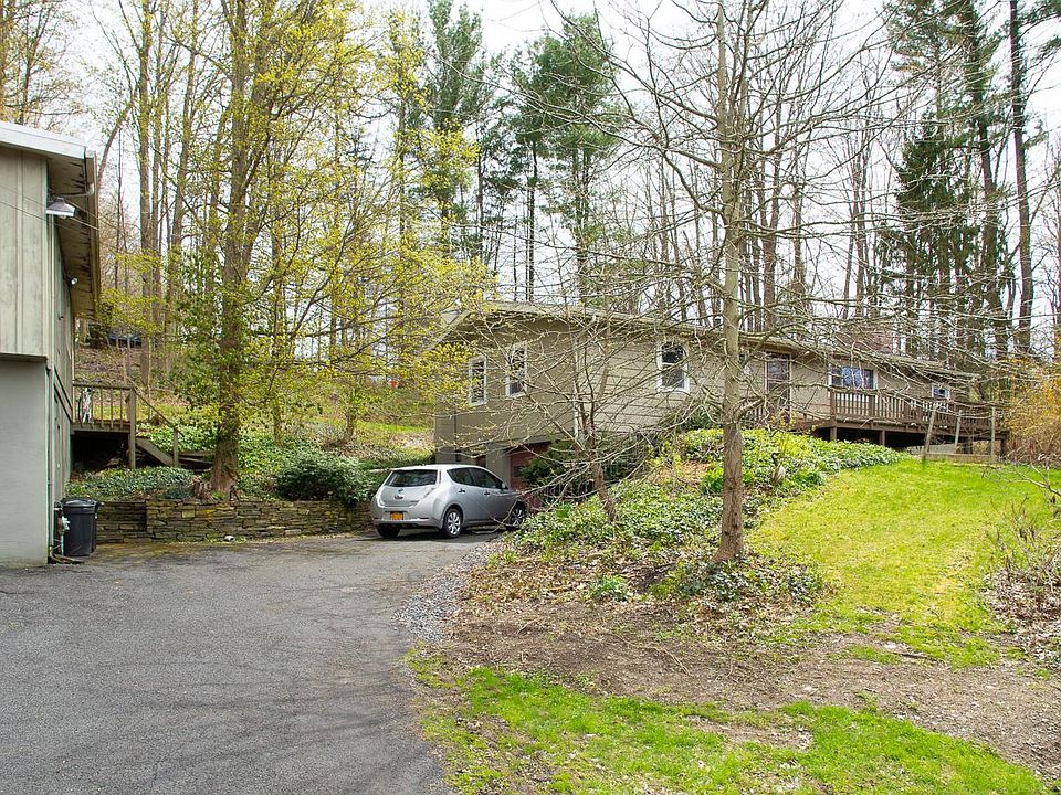 Attached one-car garage under house, large deck