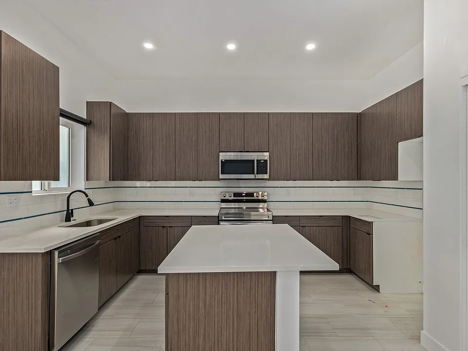 Kitchen Island Equipped with Multiple Outlets.