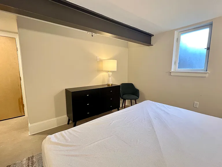 Primary bedroom, view from headboard area.