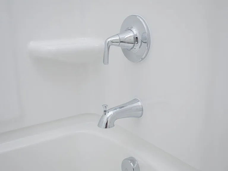Close up of the tub faucet