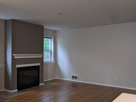 living room with wood-burning fireplace