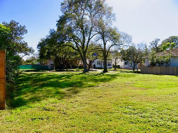 Another view from the rear of the lot showcasing the two beautiful and mature trees.