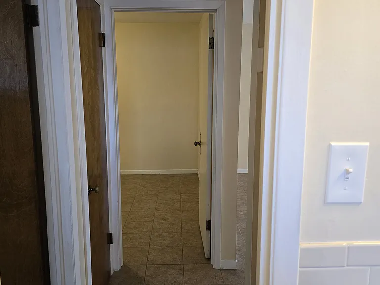 Bathroom looking into Hall and Bedroom Two