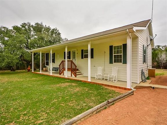 Covered porch facing W/NW - Beautiful sunsets! Deer feed in the yard this close to porch.