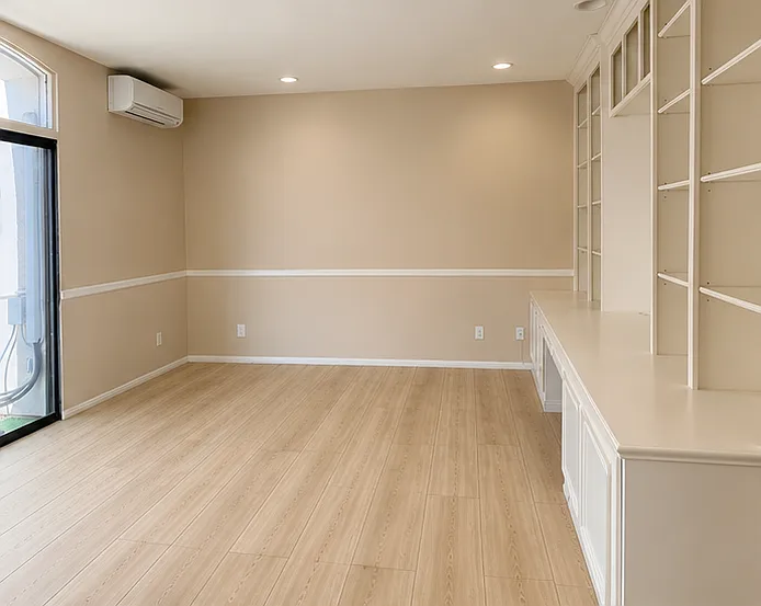 Spacious primary bedroom with built in bookshelves and desk; three closets and ensuite bathroom