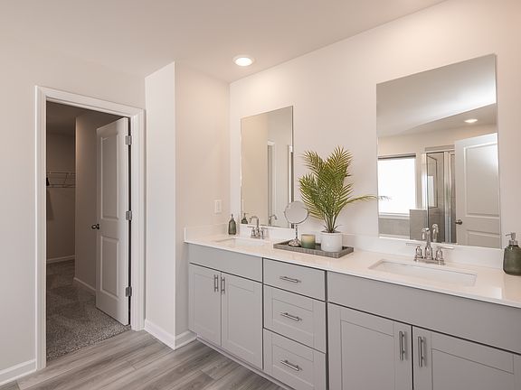The primary suite includes dual sinks that make getting ready in the morning a breeze.