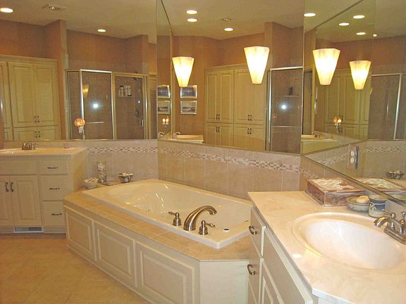 Luxuriously appointed bathroom with 2 individual sinks, lg. shower & tub 