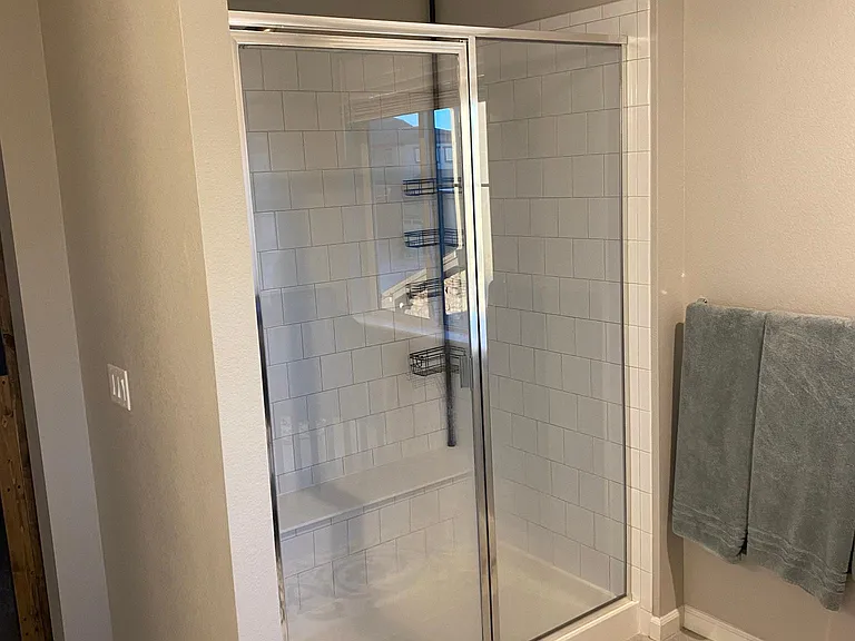Owner's bath shower with built in bench