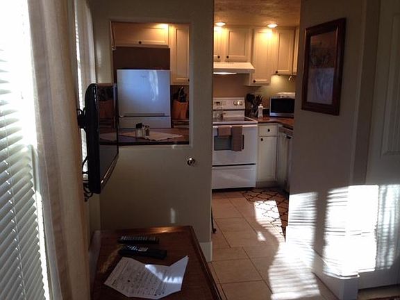 Entry door and view to kitchen.