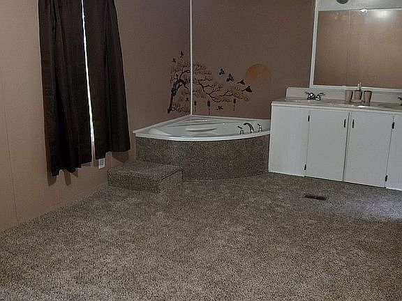 master bedroom with jacuzzi