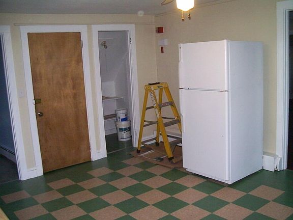 Kitchen showing entry door and pantry