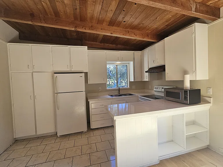 Kitchen with new quartz counters.