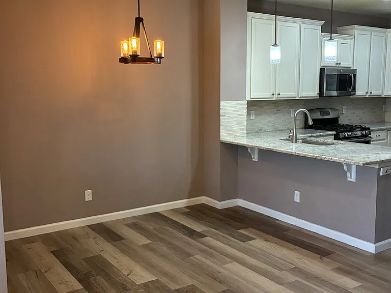 9077 E Phillips Ln — Photo 5