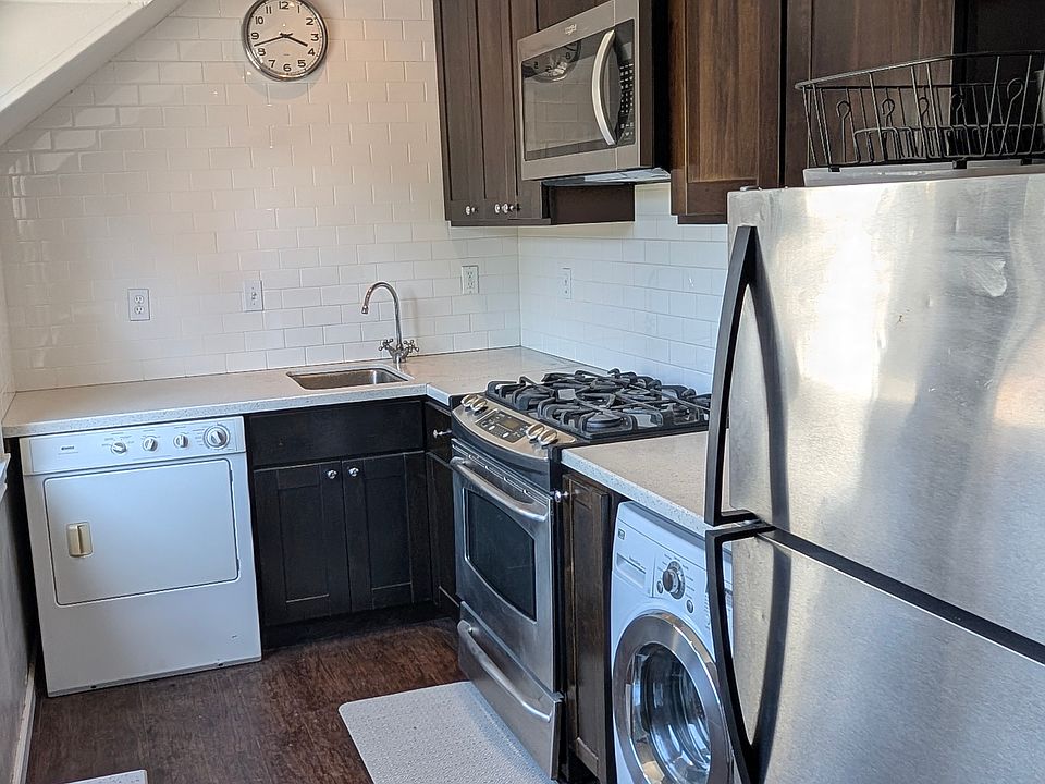 kitchen with washer/dryer combo and dryer