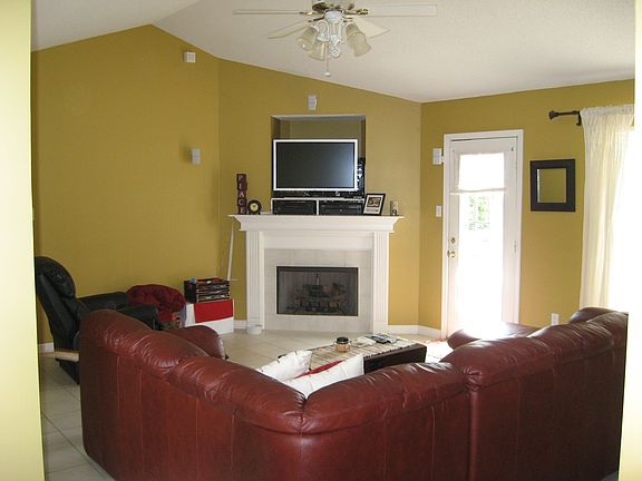 Living room with fireplace, tile flooring