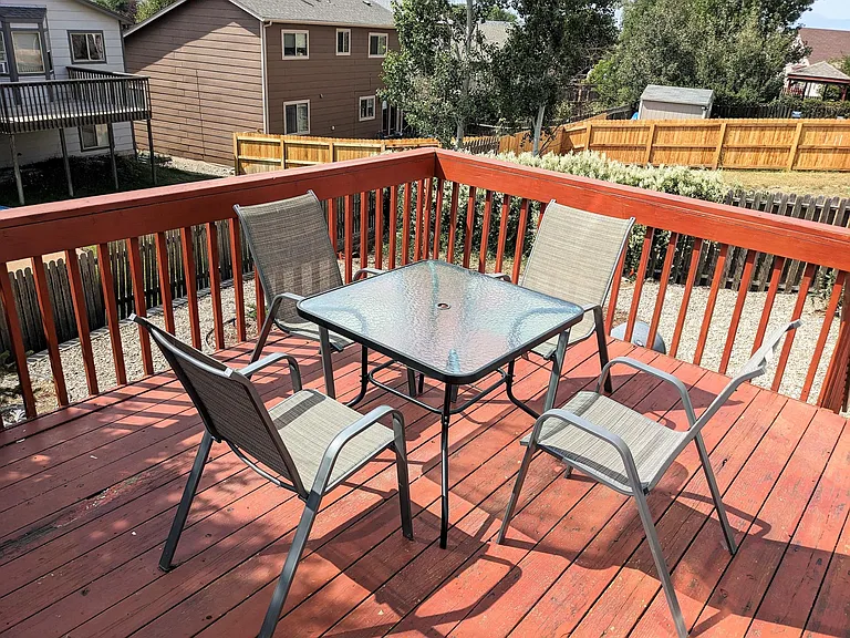 Back deck with outdoor furniture.