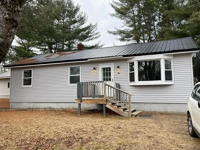 Front, one driveway to the right